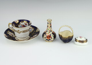 A Coalport miniature 2 handled basket with blue ground decorated with gilt flower heads 7cm, a Derby oviform Imari pattern vase 9cm, a 19th Century tea cup decorated with flowers, birds and insects together with a similar dish and a Wedgwood pill box  