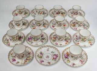 A set of 14 Dresden cups and saucers decorated with spring flowers 