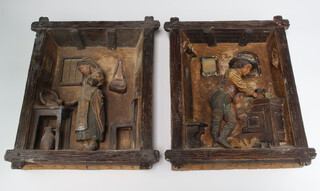 A pair of 19th Century German ceramic wall plaques in faux rustic frames depicting a lady and gentleman in interior scenes in relief 38cm x 30cm 