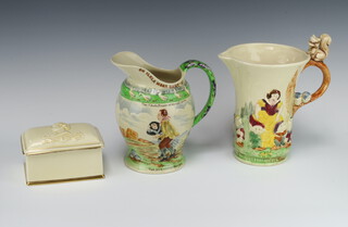 A Crown Devon Fieldings musical jug - On Ilkley Moor Baht'at 20cm, a musical jug Snow White and The Seven Dwarfs 20cm and a Royal Winton commemorative musical cigarette box 1953 Coronation 13cm 