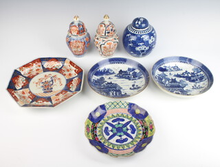 A pair of 18th Century Chinese blue and white willow pattern shallow dishes 20cm (both a/f), an octagonal Imari plate, Chinese famille verte plate a/f, 2 ginger jars (a/f) and a prunus ditto  