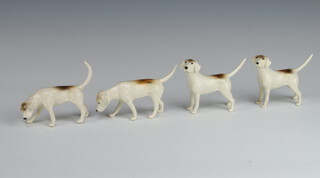 Four Beswick models of fox hounds 2263, 2264, 2265 and another 2263, all modelled by Graham Tongue, all white gloss, 6.4cm, 7cm and 7.6cm 