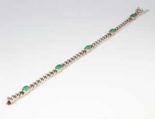 A white metal stamped 750 bracelet set with 5 cabochon cut emeralds, each 0.5ct, 22.6 grams gross, 18cm in length 