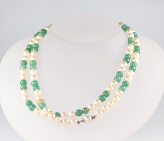 A cultured pearl and green hardstone bead necklace 76cm, with silver clasp 