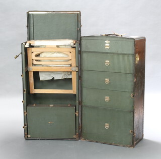 The Oshkosh Trunk Company, a wardrobe cabin trunk the interior fitted 5 drawers, shoe box and 15 hangers, the lid marked B.S Chicago USA  65cm h x 57cm w x 106cm d, complete with 2 keys  