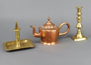 A 19th Century brass chamber stick with rectangular base 12cm h x 17cm w x 14cm d complete with snuffer, a 19th Century brass candlestick with ejector 20cm x 9cm x 7cm (some dents and a/f in places) and a 19th Century copper teapot 4cm x 8cm 