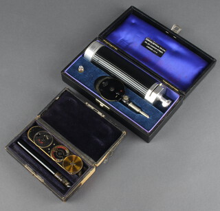 The London Optical Company, an opthalmoscope  cased, together with a DE Dezergs luminous opthalmoscope 

