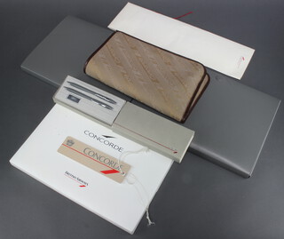 A collection of Concorde memorabilia including 3 folders containing menus, diaries, 2 luggage labels, a propelling pencil and pen cased and a tie  