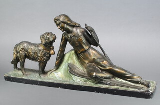 After Props Peccole, an Art Deco figure of a recumbent lady skier with standing St Bernard 33cm h x 70cm w x 15cm d  (THIS LOT APPEARS AS 864 IN THE PRINTED CATALOGUE BUT WILL BE SOLD AS LOT 643) 
