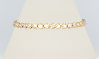 A yellow metal stamped 750 40 brilliant cut diamond bracelet, each approx. 0.05ct, total approx 2ct, 18.5cm in length, 16.5 grams 