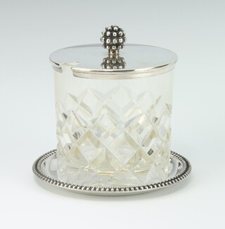 A cut glass preserve jar with sterling silver lid and base  