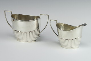 A silver demi-fluted 2 handled sugar bowl and ditto milk jug, Birmingham 1923, 358 grams 
