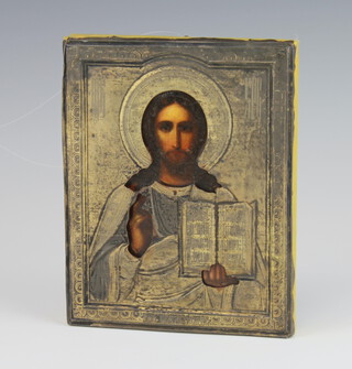 An 18th/19th Century Russian Orthodox icon, oil on panel, of Christ Pantocrator in a white metal oklad 18cm x 14cm  