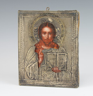 A 19th Century Russian Orthodox icon, oil on panel, of Christ The Pantocrator with an embossed and engraved silver oklad 18cm x 15cm 