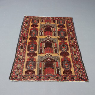 A brown and red ground Belouche rug, the centre decorated 3 buildings within a 3 row border 140cm x 84cm 