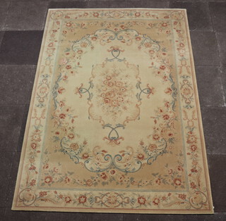 An Aubusson style cream ground and floral patterned machine made rug 239cm x 170cm 