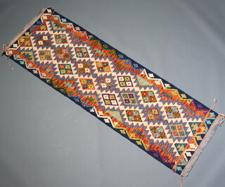 A blue, white and green ground Chobi Kilim runner with all over geometric design 203cm x 67cm 