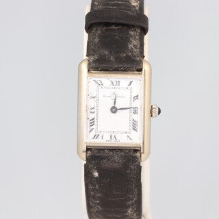 A steel cased Baume & Mercier wristwatch, contained in a white metal case 27mm x 20mm no.746150.38307 on a leather strap with original box 