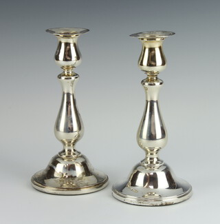 A pair of 925 standard candlesticks of baluster form 18cm 
