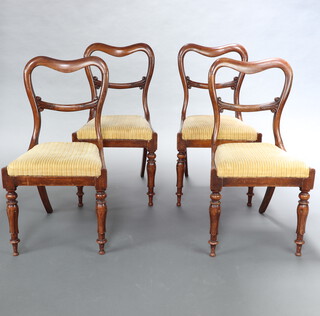 A set of 4 Victorian rosewood spoon back dining chairs with drop in seats raised on turned and fluted supports 86cm h x 46cm w x 40cm d (seat 26cm x 25cm) 