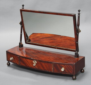 A 19th Century rectangular plate dressing table mirror raised on a mahogany bow front base fitted 3 drawers, raised on bun feet 62cm h x 81cm w x 28cm d 