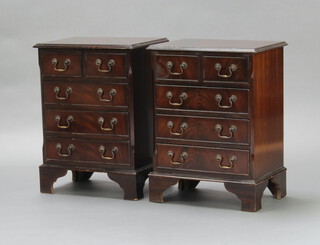 A pair of Georgian style inlaid and crossbanded mahogany bedside chests of 2 short and 3 long drawers with brass swan neck handles 61cm h x 46cm w x 32cm d  