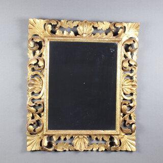 A 19th Century Rococo style rectangular plate mirror contained in a carved pierced gilt frame 70cm h x 60cm w 