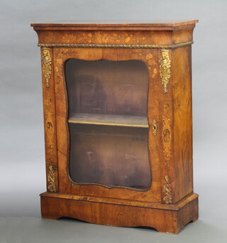 A Victorian walnut and inlaid marquetry pier cabinet with gilt metal mounts, fitted a shelf enclosed by an arch glazed panelled door 109cm h x 84cm w x 33cm d 