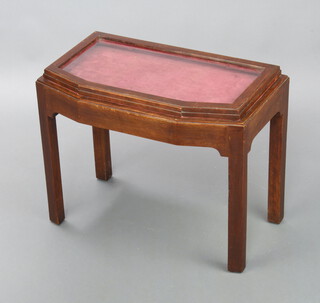 An Art Deco style shaped mahogany bijouterie table with hinged lid, raised on squared supports 50cm h x 61cm w x 36cm d 