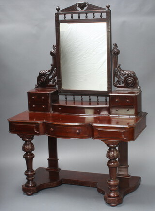 A Victorian mahogany Duchess dressing table with rectangular plate mirror to the centre above 1 long and 4 short drawers, the base fitted a drawer, raised on turned cup and cover supports 168 cm h x 120cm w x 56cm d 