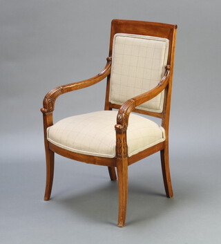 An Empire style walnut show frame armchair, the seat and back upholstered in green material, raised on outswept supports 90cm h x 57cm x 42cm  (seat 31cm x 31cm)  