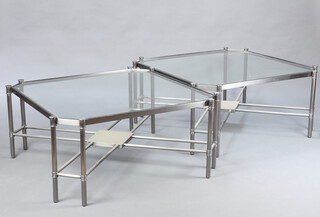 A pair of octagonal mid-Century tubular metal and plate glass tables, raised on 8 cylindrical supports with X framed stretchers, 46cm x 95cm x 95cm  