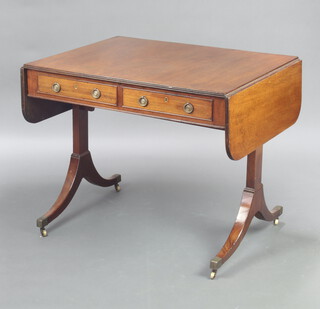 A 19th Century mahogany sofa table fitted 2 drawers with replacement ring drop handles, raised on standard end supports with brass caps and casters 73cm h x 86cm w x 69cm d 