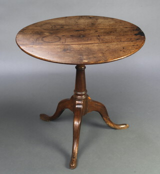 A Georgian circular mahogany snap top tea table with birdcage action, raised on a turned column and tripod base 70cm h x 76cm diam. 