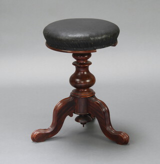 A Victorian mahogany adjustable piano stool raised on pillar and tripod base 50cm h x 35cm diam. 