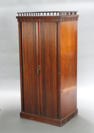 A 19th Century Continental mahogany office cabinet with 3/4 gallery, the interior fitted 4 shallow trays enclosed by a pair of tambour shutters 148cm h x 68cm w x 52cm d 