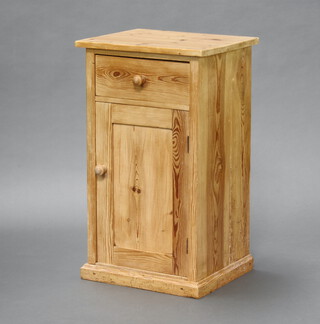 A Victorian pine pot cupboard fitted a drawer above a panelled door 71cm h x 42cm w x 36cm d  