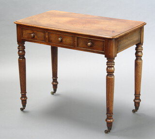 A Victorian mahogany side table fitted 3 short drawers, raised on turned supports 76cm h x 90cm w x 54cm d 