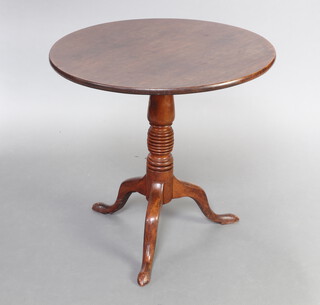 A 19th Century circular mahogany snap top tea table raised on turned column and tripod base 71cm h x 75cm diam. 