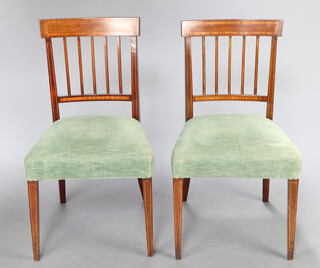A pair of 19th Century inlaid mahogany stick and bar back dining chairs with overstuffed seats, raised on square tapered supports 87cm h x 50cm w x 42cm d (seat 26cm x 30cm) 