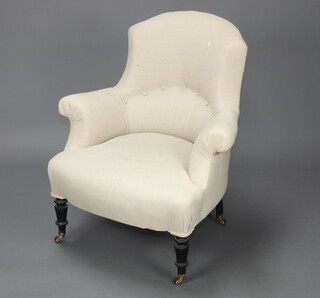 A Victorian armchair upholstered in buttoned white material, raised on turned supports 87cm h x 77cm w x 55cm d (seat 26cm x 32cm) 