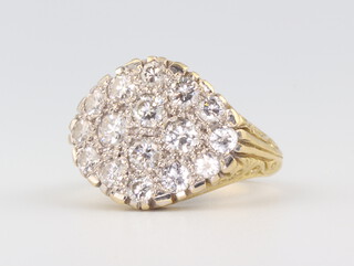 A yellow metal diamond cluster ring containing 16 brilliant cut diamonds totalling approx 1.7ct, size M ,  10.2gms