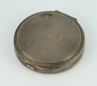 A circular silver Art Deco engine turned compact with engraved monogram Birmingham 1938, 8cm, maker Turner and Simpson 
