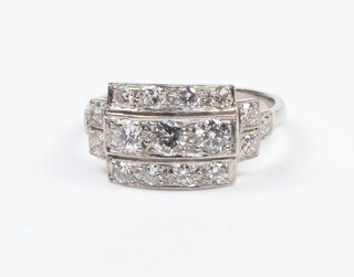 A white metal, stamped Plat, Edwardian style triple row diamond ring, approx 1.2ct, size P, 5.6gms