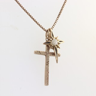 A 9ct yellow gold cross pendant, a yellow metal chain and a yellow metal pendant, gross weight 6.5gms