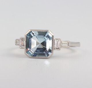 A white metal, stamped Plat, aquamarine and diamond ring, the centre stone approx 1.6cts, the four baguette cut diamonds 0.2 ct, size N, 4.1gms