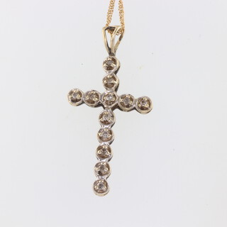 A 9ct yellow gold diamond set cross pendant and chain, 42cm, gross 2.3gms