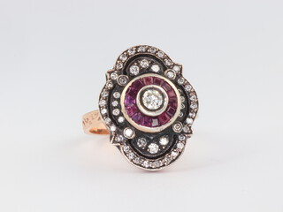 An antique style rose coloured metal ruby and diamond ring, size O 7.2gms