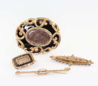 A 19th Century gilt and enamelled In Memoriam brooch, 45mm x 40mm, a smaller rectangular ditto, a 9ct bar brooch and a yellow metal bar brooch