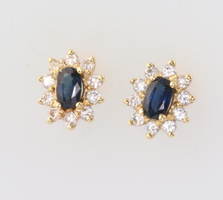 A pair of 18ct yellow gold oval sapphire and diamond ear studs, 8mm x 6 mm, 2.5gms